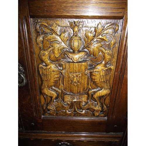 238 - A crested carved side cabinet