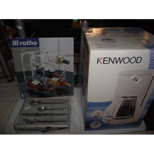 254 - A new boxed Kenwood coffee maker, wine rack and box of cutlery