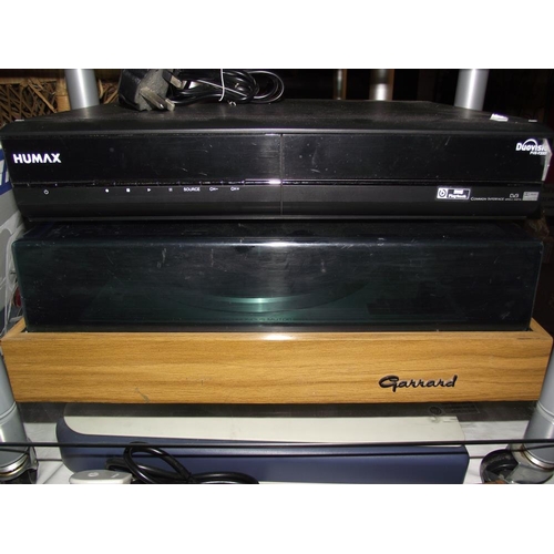 255 - A Garrard record deck (lid a/f), Amstrad double decker VHS player, teleton stereo amplifier SAQ 307 ... 