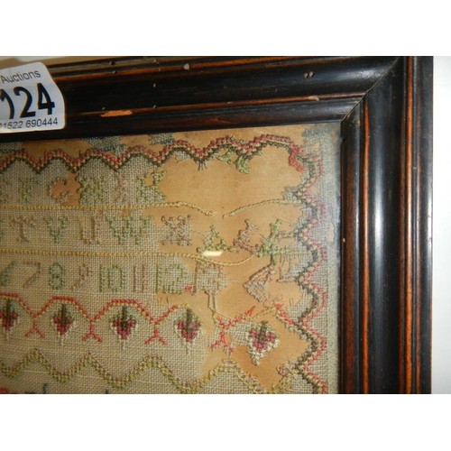 1124 - A framed and glazed Georgian sampler dated 1779 by Mary Ann Pulleg her work, COLLECT ONLY.