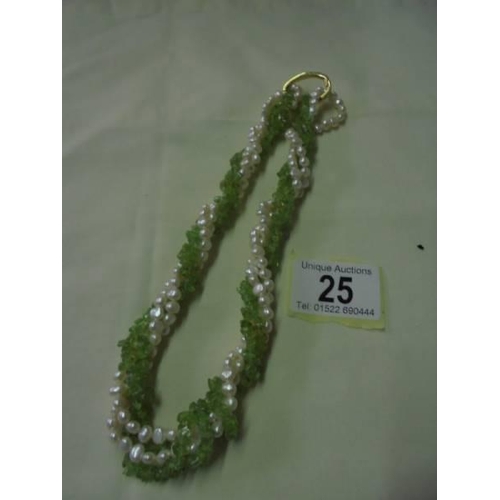 25 - A green coral and natural pearl necklace.