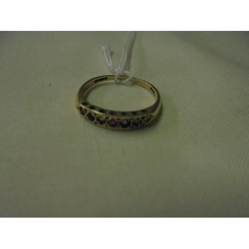 35 - A 9ct gold ring set multi-coloured stones, size M. 1.2 grams.
