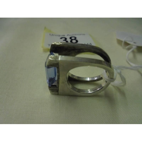 38 - A silver ring set large blue stone, size K, 13.5 grams.