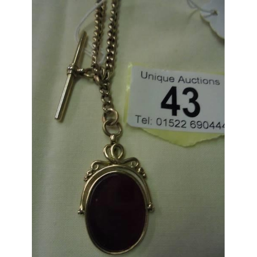 43 - A 9ct carat Watch Albert chain with attached fob, 38.6 grams.
