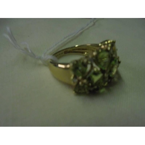 47 - A 9ct gold ring set green stones, size M, 4.4 grams.