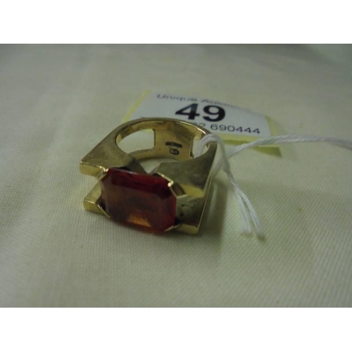 49 - A 9ct gold ring set large red stone, size L, 9.5 grams.