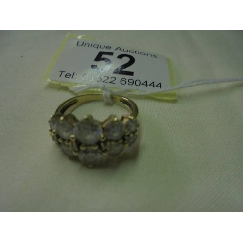 52 - A 9ct gold ring set clear stones, size M, 3.9 grams.