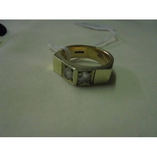 55 - A 9ct gold angled ring set two diamonds, size M, 7.2 grams.