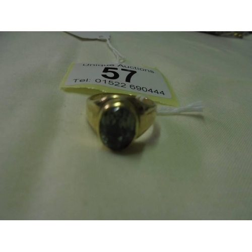 57 - A gold ring set green stone (hallmark rubbed), size L half, 6 grams.