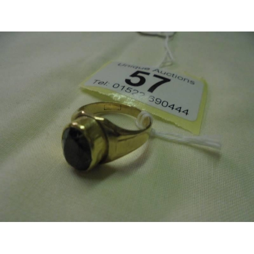 57 - A gold ring set green stone (hallmark rubbed), size L half, 6 grams.
