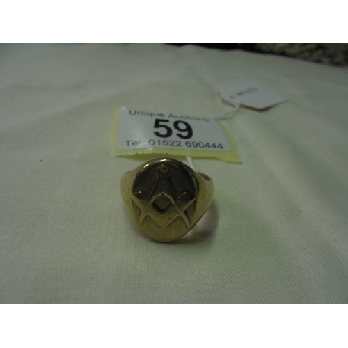 59 - A 9ct gold man's Masonic ring, size S, 12.2 grams.