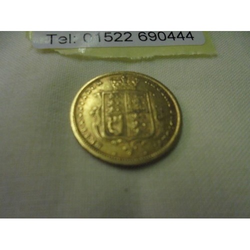 65 - A Victoria 1884 gold half sovereign.