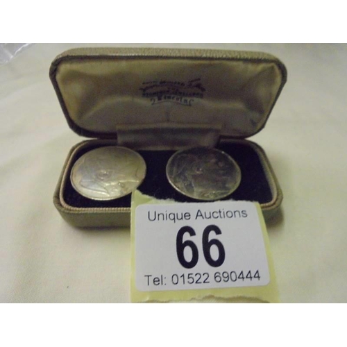 66 - A pair of old coin cuff links in a John Smith & Son Jewellers Lincoln case.