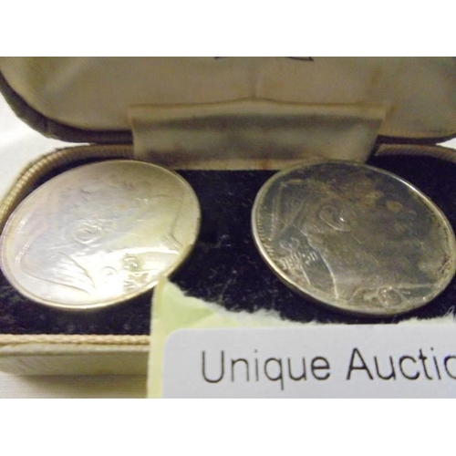 66 - A pair of old coin cuff links in a John Smith & Son Jewellers Lincoln case.
