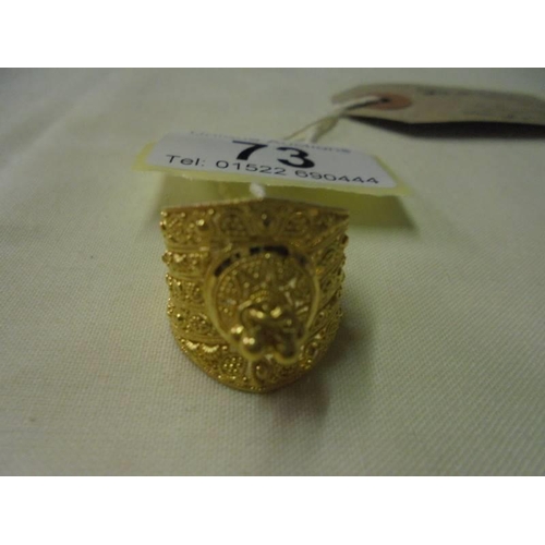 73 - An ornate 22ct gold ladies ring, size N, 7 grams.