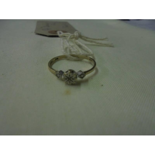 79 - A 9ct gold diamond ring, size L.
