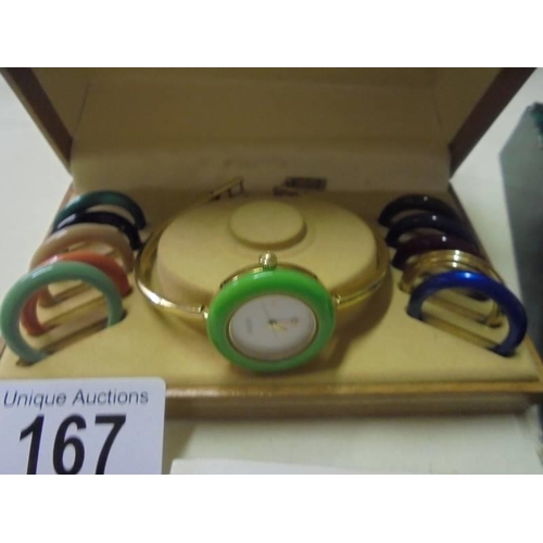 167 - A Gucci ladies wrist watch with interchangable bezels with original 1991 purchase receipt.