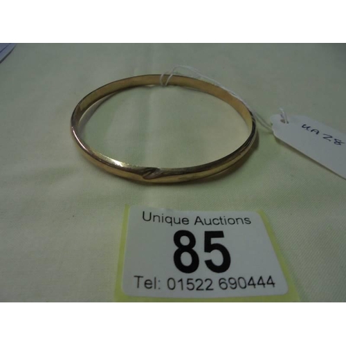85 - A 9ct gold slave bracelet (has small dent), 6.5 grams.