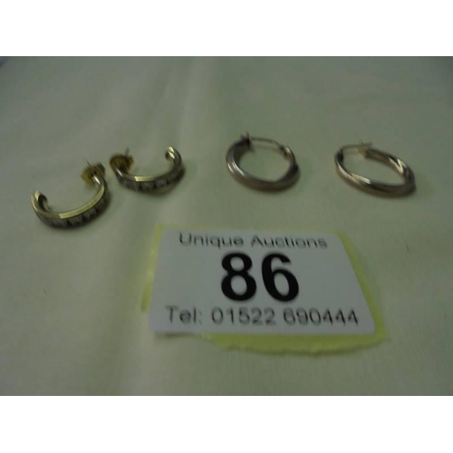 86 - A pair of gold plate earrings marked 925 and a pair of yellow metal earrings.