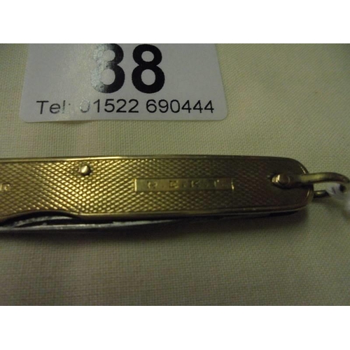 88 - A 9ct gold pen knife,