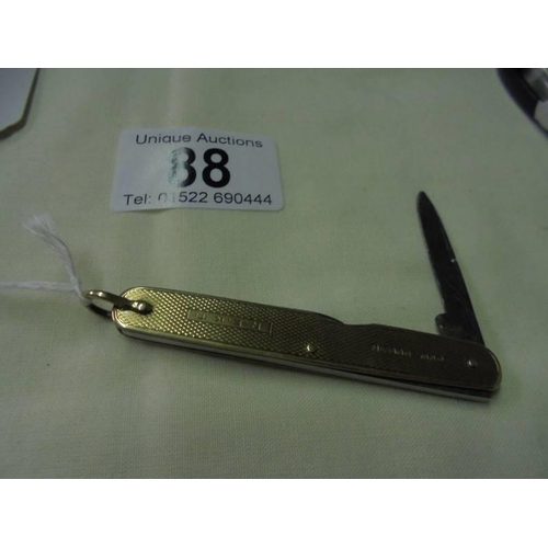 88 - A 9ct gold pen knife,