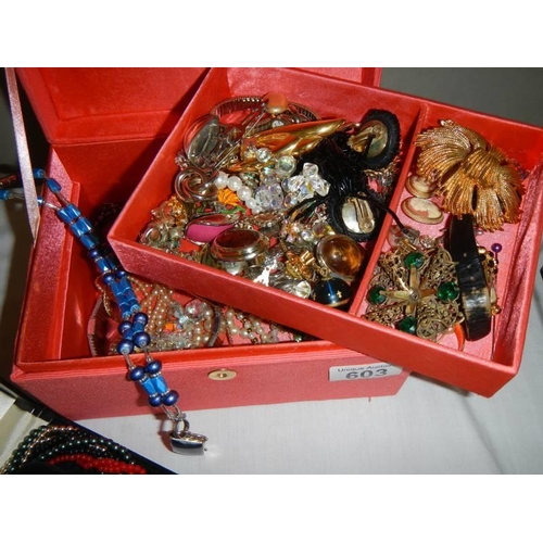 603 - A jewellery box with costume jewellery including cased Lotus multi-coloured necklace.