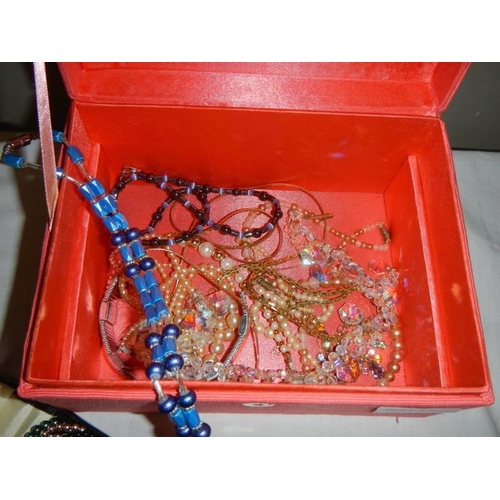 603 - A jewellery box with costume jewellery including cased Lotus multi-coloured necklace.