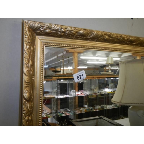 621 - A large gilt framed mirror, 86 x 61 cm.