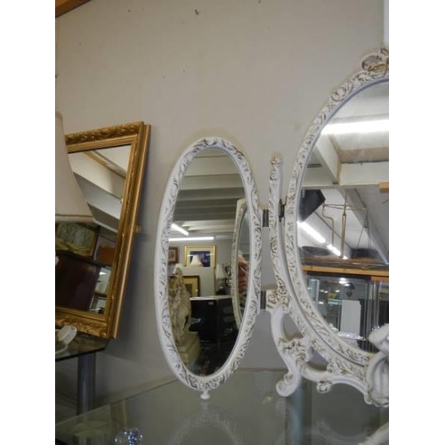 638 - An ormolu style tripal oval framed dressing table mirror. COLLECT ONLY.