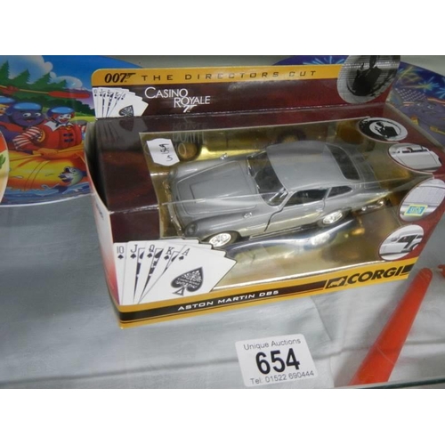 654 - A boxed Corgi Casino Royale Aston Martin DB5 and four McDonalds 1998 melamine plates.