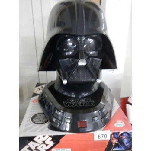 670 - A boxed Star Wars 'Darth Vadar' radio and CD player.