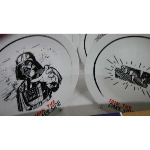 673 - A boxed set of Star Wars 'Join the Dark Side' plates.