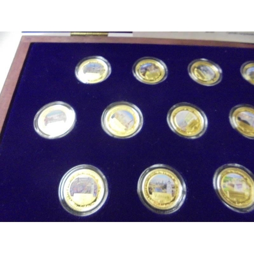 217 - A limited edition cased set of 27 gold plate on copper commemorative coins.