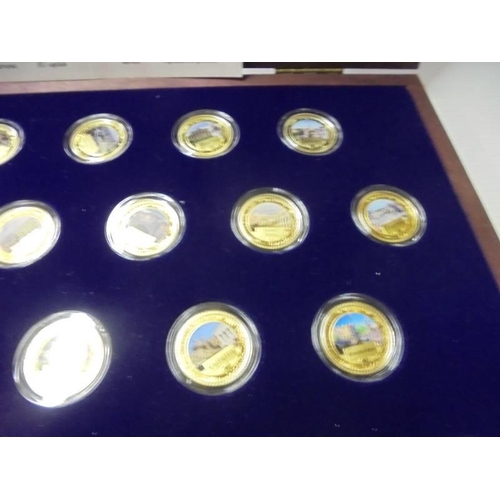 217 - A limited edition cased set of 27 gold plate on copper commemorative coins.