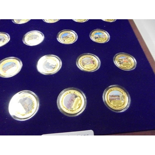 217 - A limited edition cased set of 27 gold plate on copper commemorative coins.