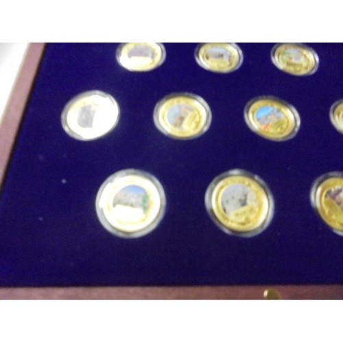 217 - A limited edition cased set of 27 gold plate on copper commemorative coins.