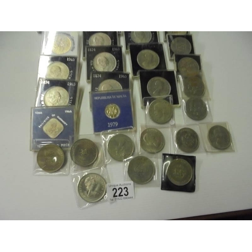 223 - Approximately 45 commemorative coins including Royalty, Churchill etc.,