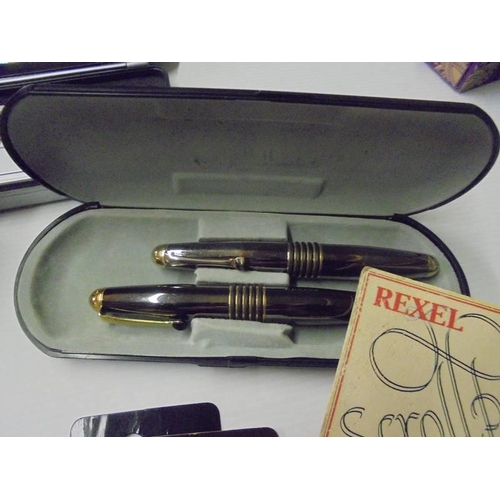 232 - An assortment of writing implements including Parker pen sets, fountain pen with gold nib, other box... 