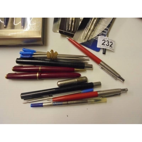 232 - An assortment of writing implements including Parker pen sets, fountain pen with gold nib, other box... 