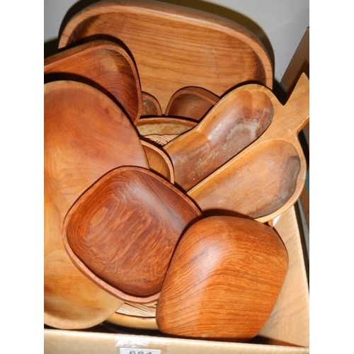 684 - A box of hardwood serving bowls.