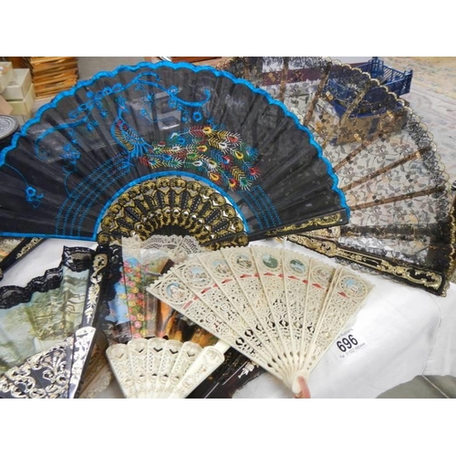 696 - Twelve decorative fans.