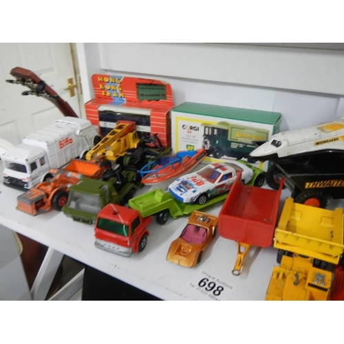 698 - A box of playworn and boxed mixed die cast includint Triang, Corgi, Matchbox etc.