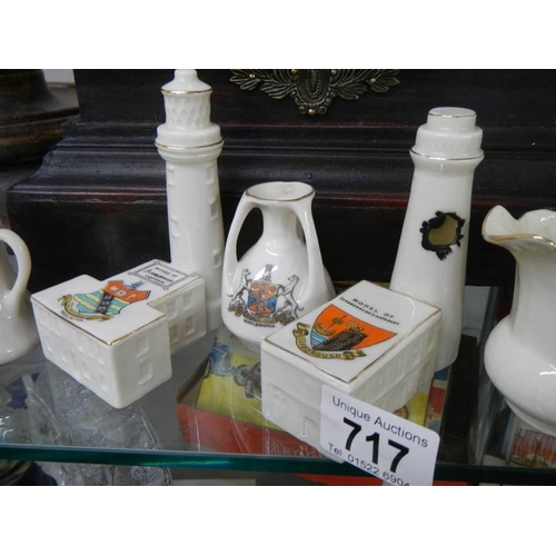 717 - A quantity of crested china including A pair of crested china lighthouses - bomb damaged Scarborough... 