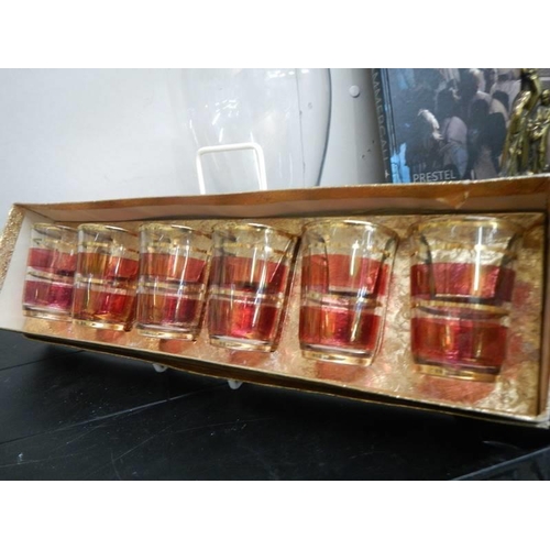 732 - A boxed set of vintage gilded shot glass and a carafe/decanter, COLLECT ONLY.