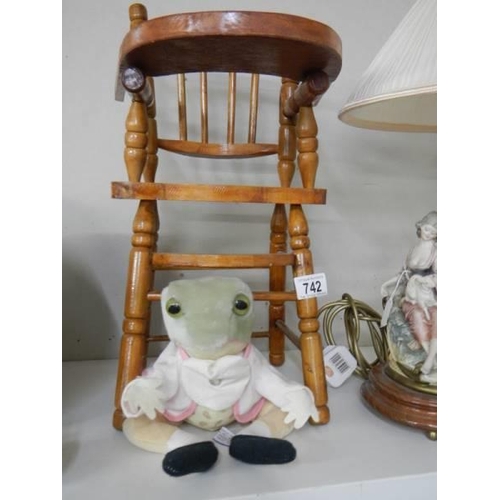 742 - A wooden doll high chair with a Beatrix Potter frog soft toy. COLLECT ONLY.