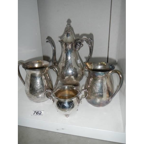 762 - A four piece silver plate tea set.