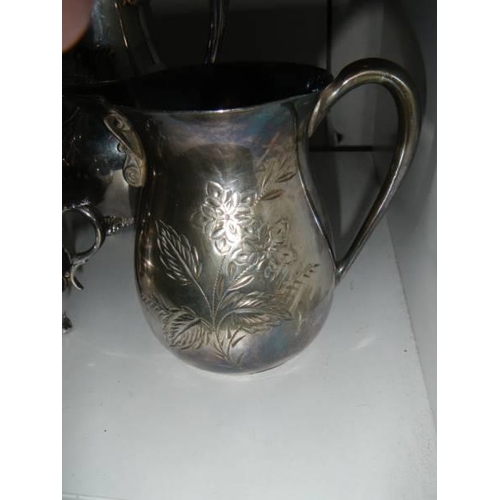 762 - A four piece silver plate tea set.