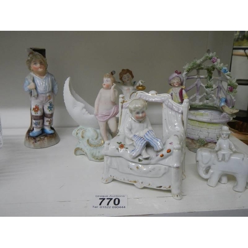 770 - A mixed lot of continental bisque porcelain figures etc.,