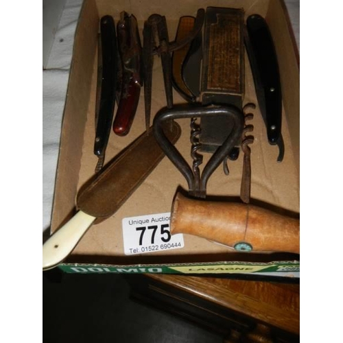 775 - A quantity of old cut throat razors etc.,