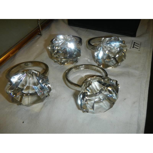 777 - A boxed set of clear napkin rings in the style of a diamond solitaire ring.